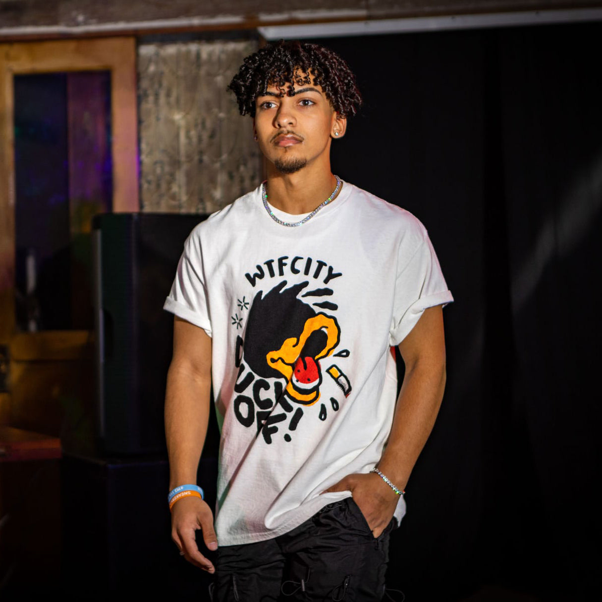 Model wearing DUCK OFF! T-shirt on runway.